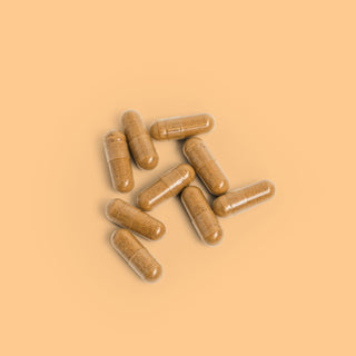 Close-up of Herbaly's Glucose Blood Sugar Complete Capsules showing their size, shape, and color