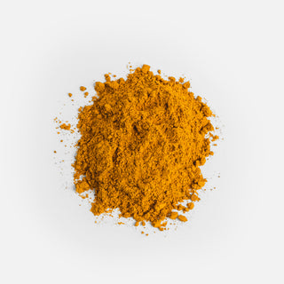 Close-up of the orange powder from Herbaly's Heart Turmeric Complete Plus CoQ10 Capsules showing its fine texture